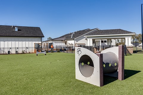 a playground in front of a group of houses