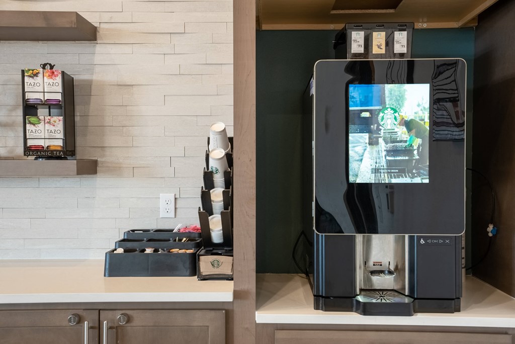 a coffee machine sitting on top of a kitchen counter
