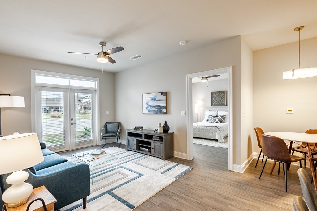 an open living room and dining room with a couch and a table