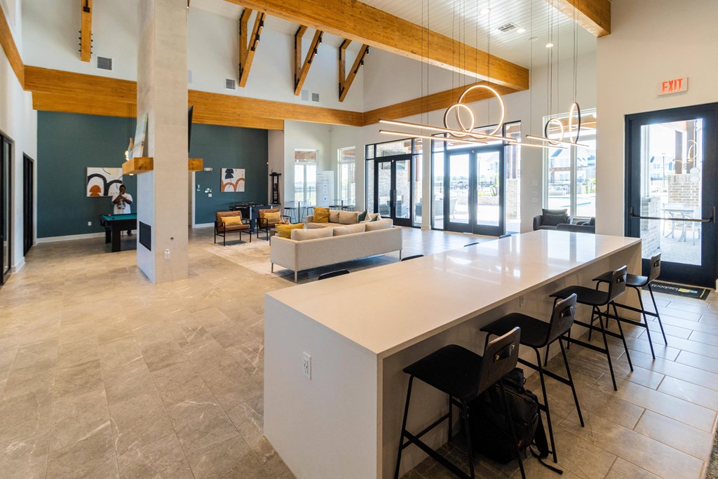 a communal area with a long table and chairs in a lobby