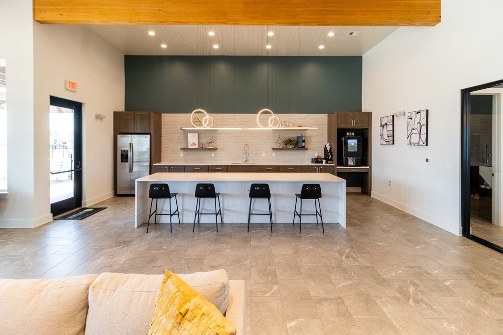 the kitchen is open to the living room and dining area