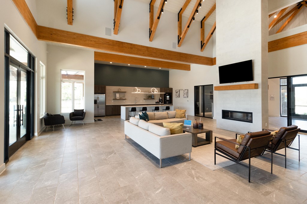 a large living room with a white couch and a fireplace