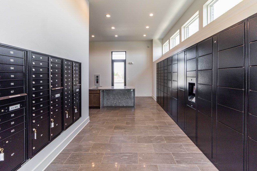 a utility room with lockers and a sink