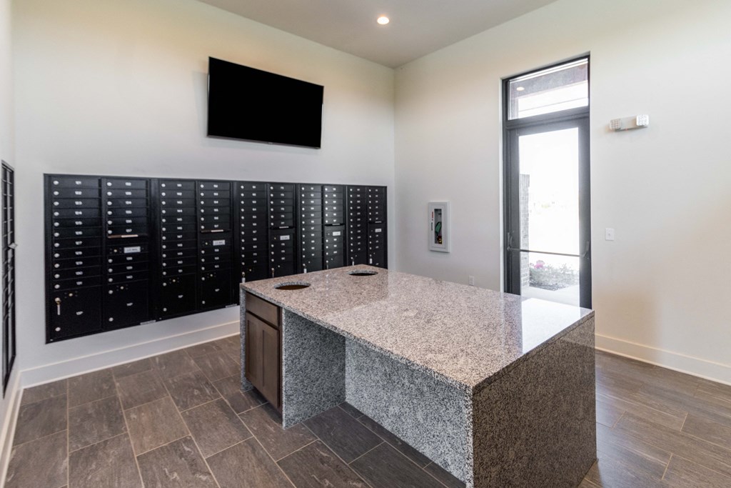 a kitchen with a granite counter top and a door to a cybercrime room