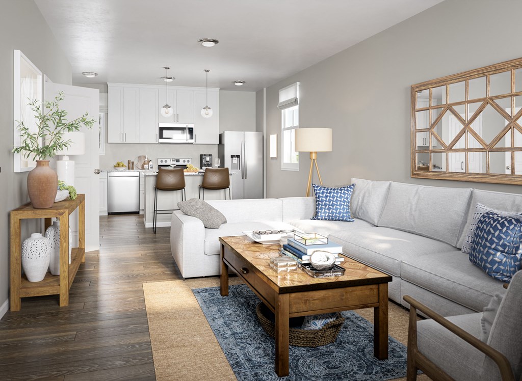 A modern living room with a white sofa and a wooden coffee table.