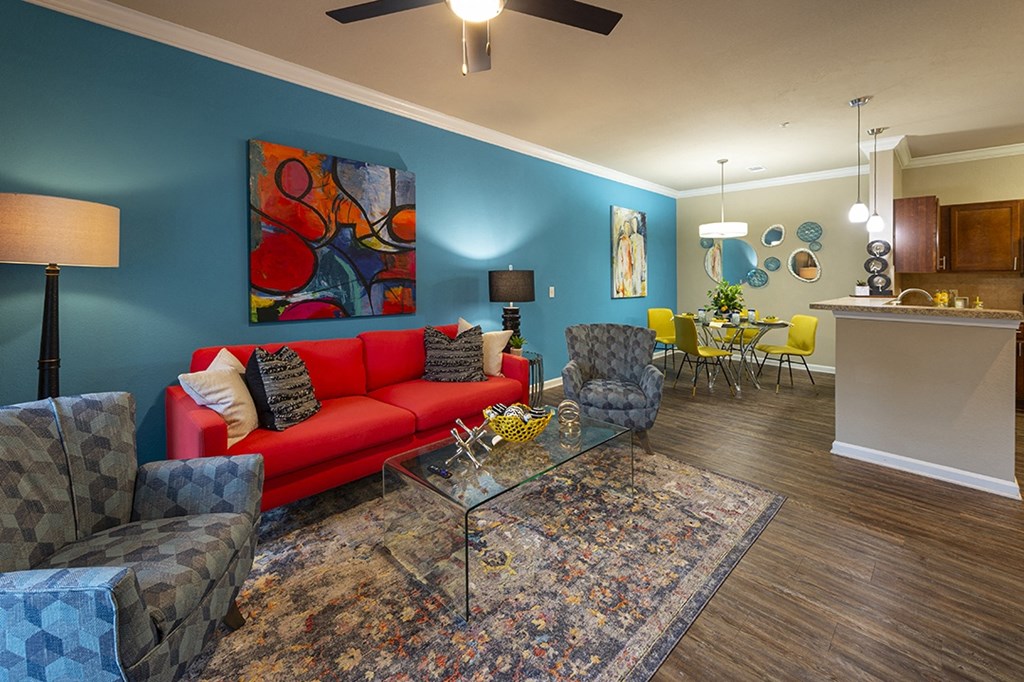 Myrtle Beach SC Apartments - Lattitude @ The Commons - Spacious Living Room with a Ceiling fan and Woodstyle Flooring