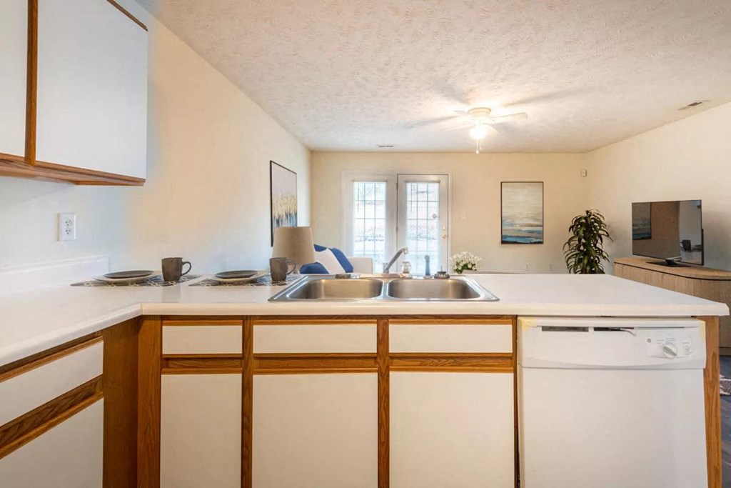 a kitchen with a sink and a counter top