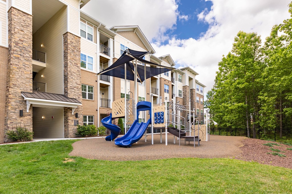 the preserve at ballantyne commons playground with a blue swing set