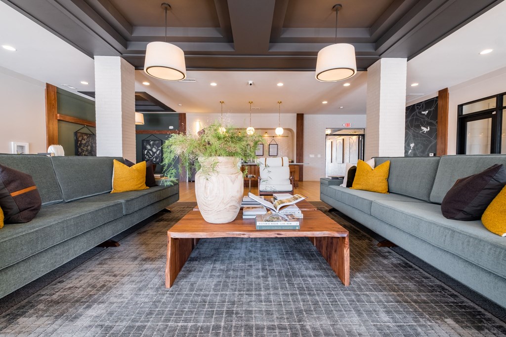 a living room with couches and a coffee table