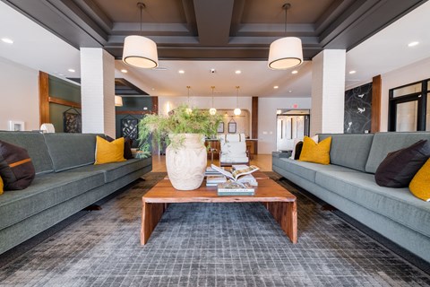 a living room with couches and a coffee table