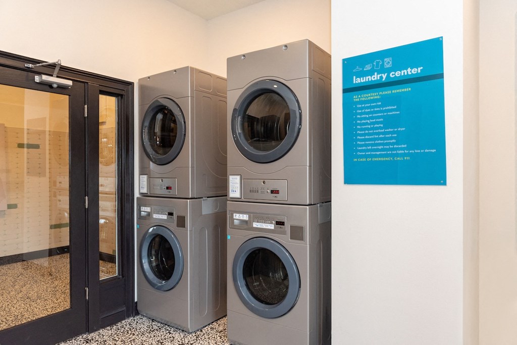 a row of washing machines in a laundry center