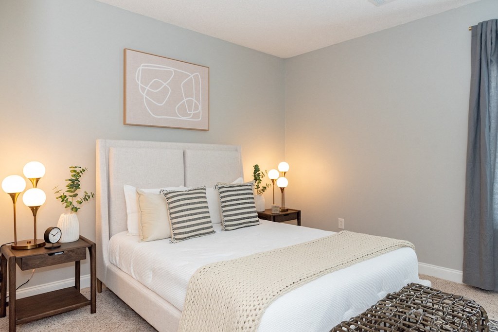 Home Interior a bedroom with a white bed and grey walls