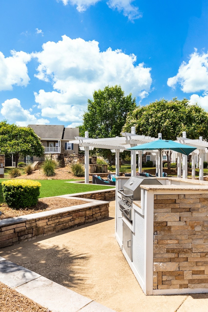 the preserve at ballantyne commons clubhouse with outdoor kitchen and gazebo
