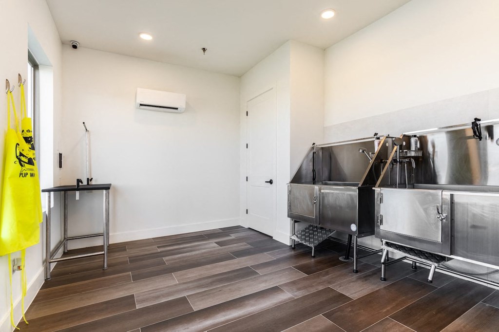 A kitchen with a yellow bag hanging on the wall.