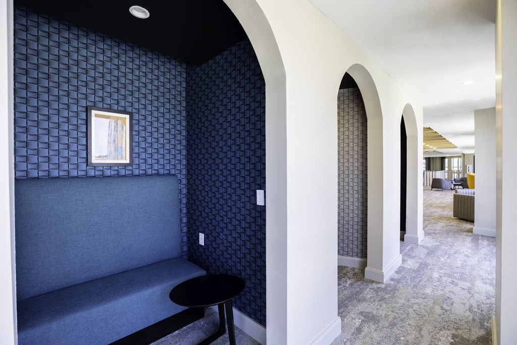 Built in booth style seating and tables in clubhouse at 27Seventy Lower Heights apartments in Houston, TX.