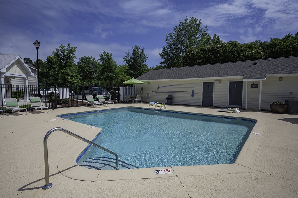 our resort style pool is in front of our house and is next to a building