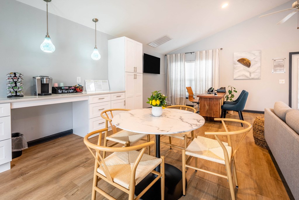 sitting areas by coffee bar in clubhouse