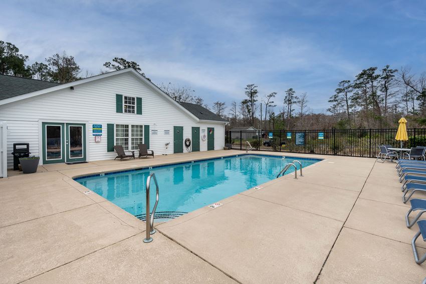 sparkling swimming pool and large pool deck