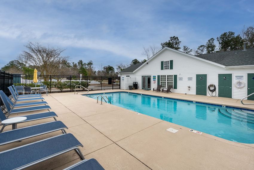 sparkling swimming pool with large lounging area