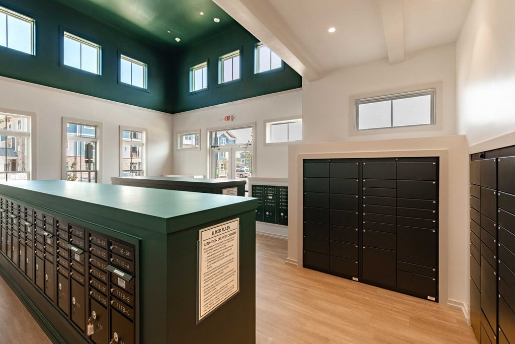 a tasting room with a green counter and a row of lockers