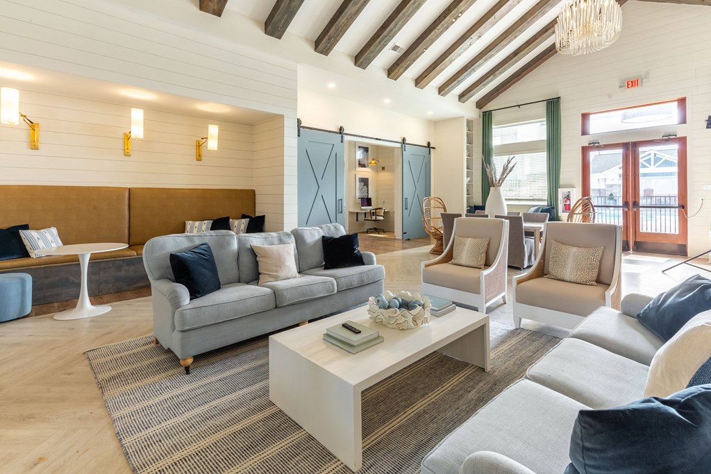 a living room with couches and chairs and a coffee table