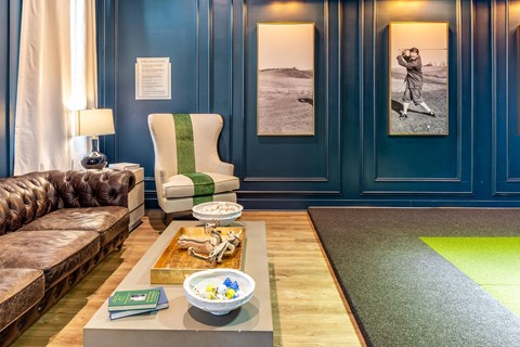 a living room with blue walls and a couch and a coffee table