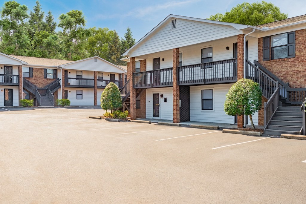 a parking lot at the whispering winds apartments in pearland, tx