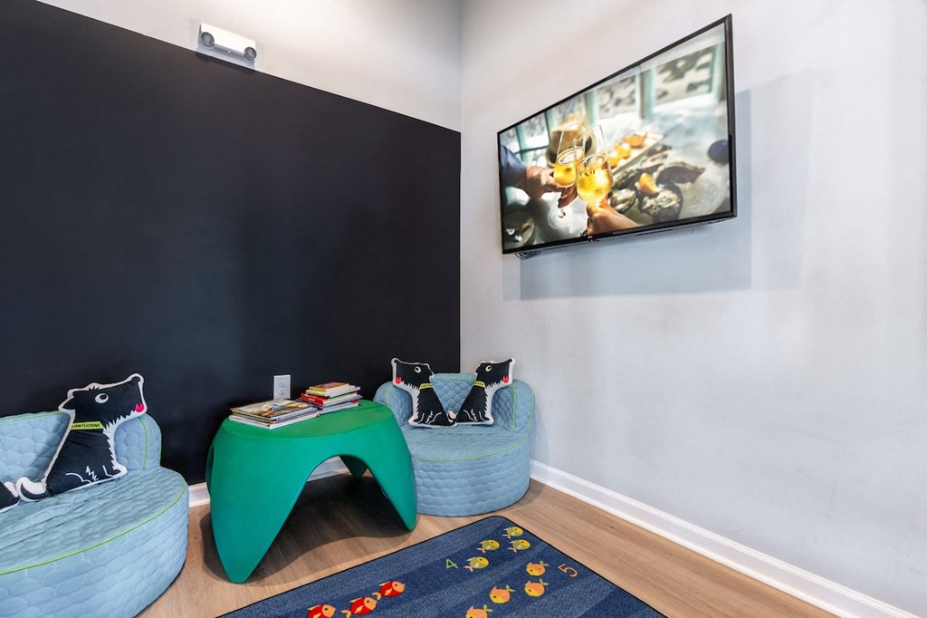 a living room with two couches and a green table