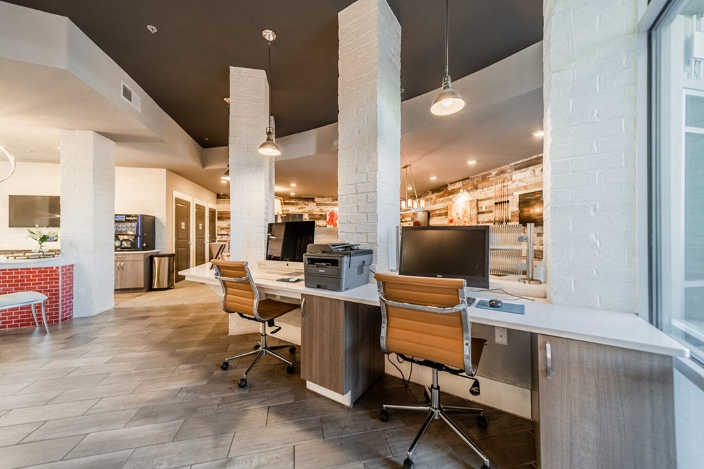 a break room with two desks and chairs in a restaurant
