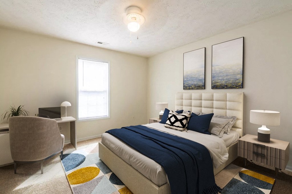 a bedroom with a bed and a desk with a chair