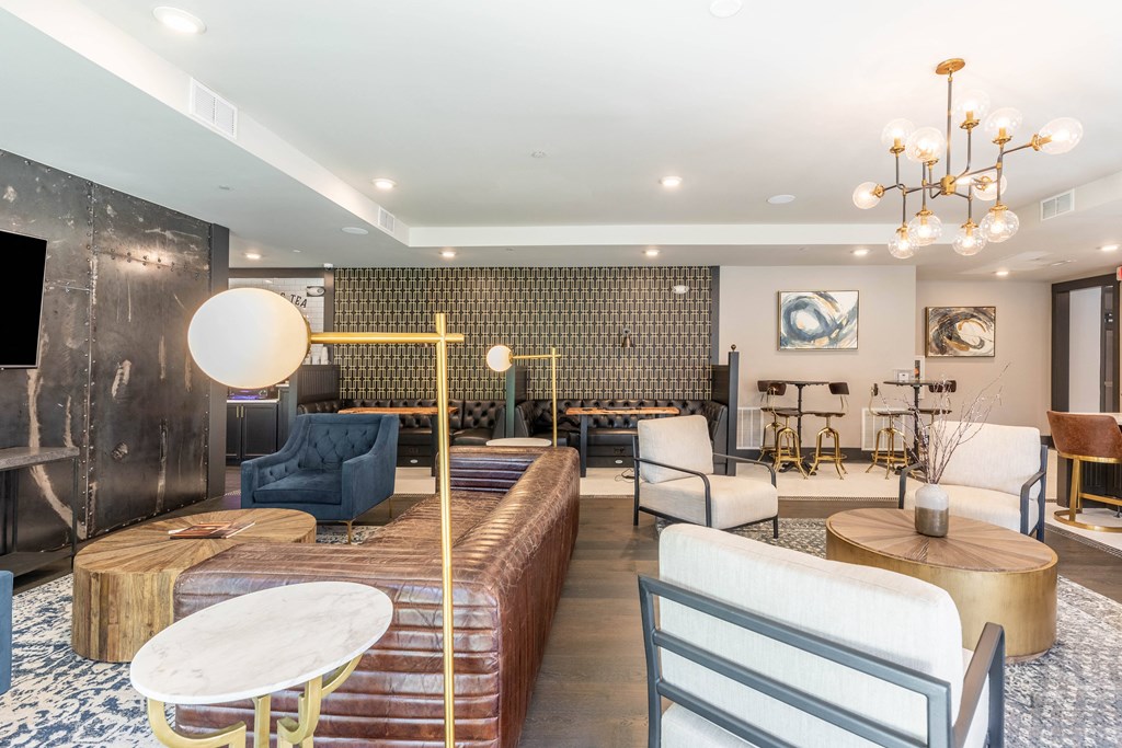 a living room with couches chairs and a table