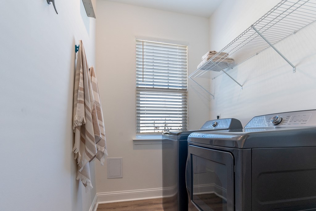 A laundry room with a washer and dryer.