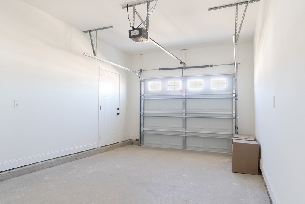 an empty room with white walls and white closets