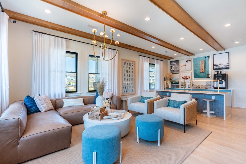 a living room with couches and chairs and a table