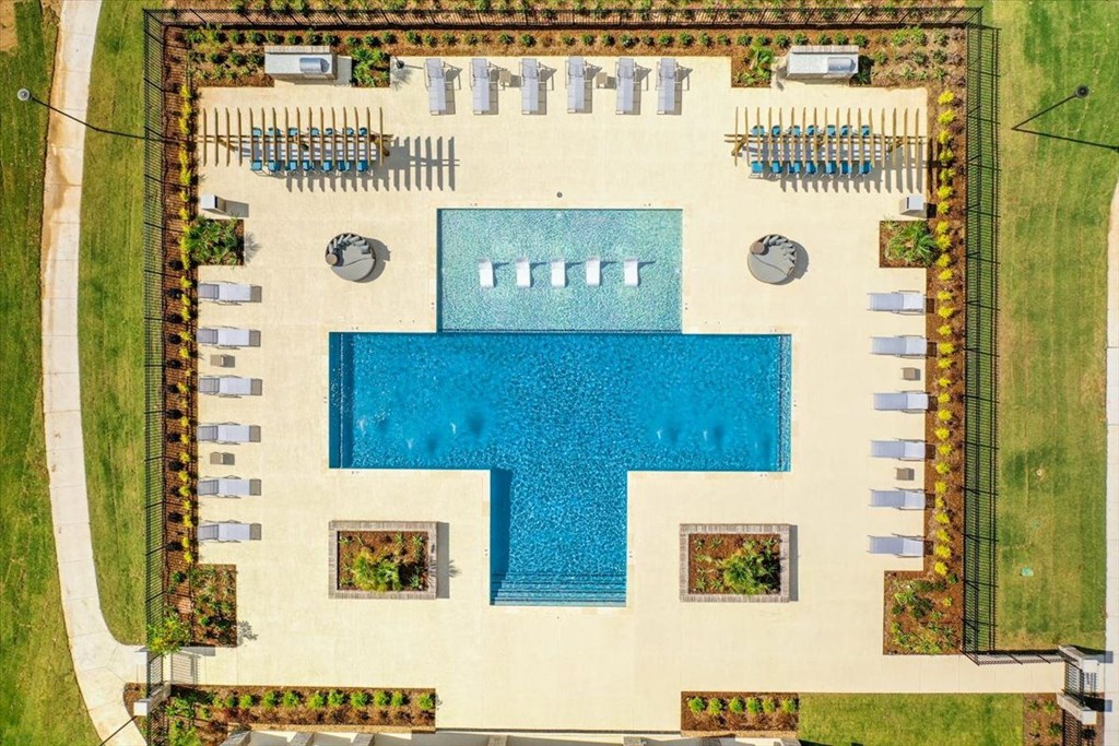 arial view of the pool area of a resort with a swimming pool