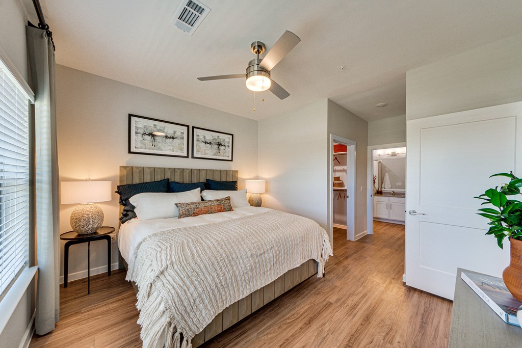 Beautiful bedroom with 9-foot ceilings and luxury plank-style flooring
