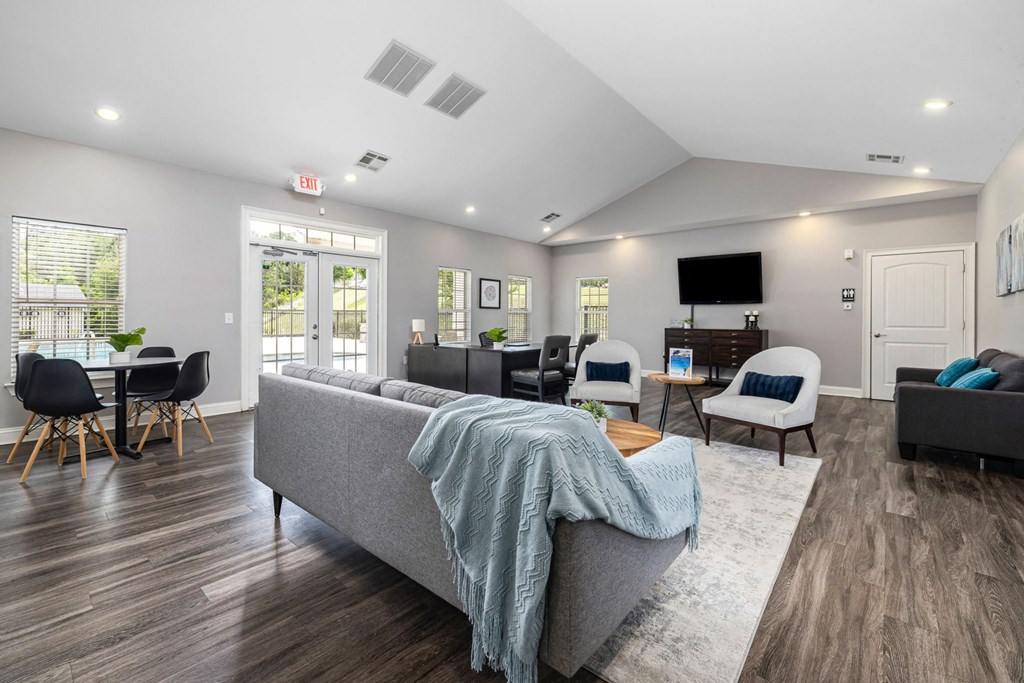 a room filled with furniture and a wall with a pattern on it