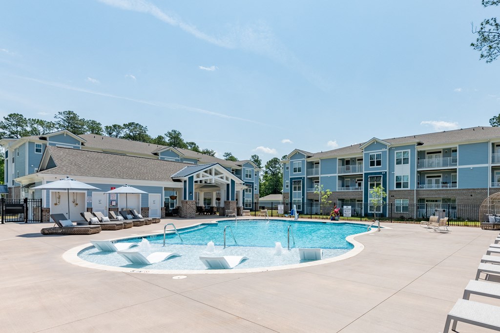 the preserve at ballantyne commons community swimming pool with apartment buildings