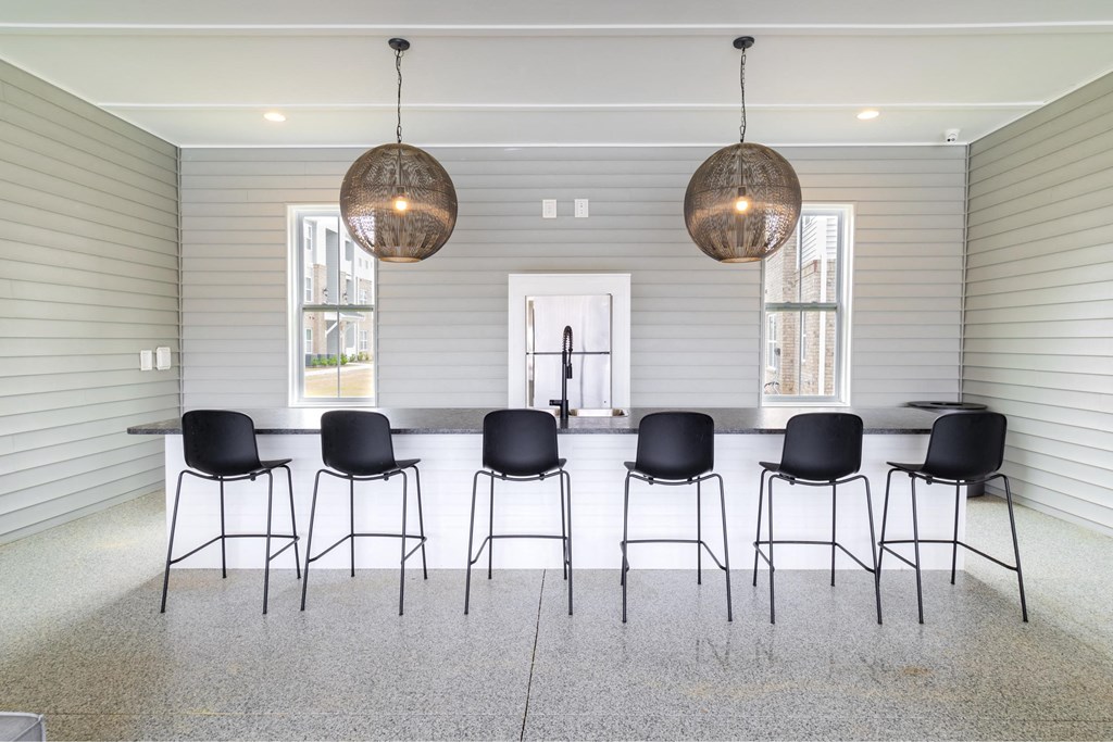 a large dining room with a long table and chairs