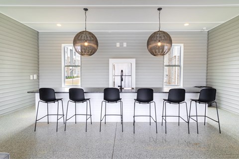 a large dining room with a long table and chairs