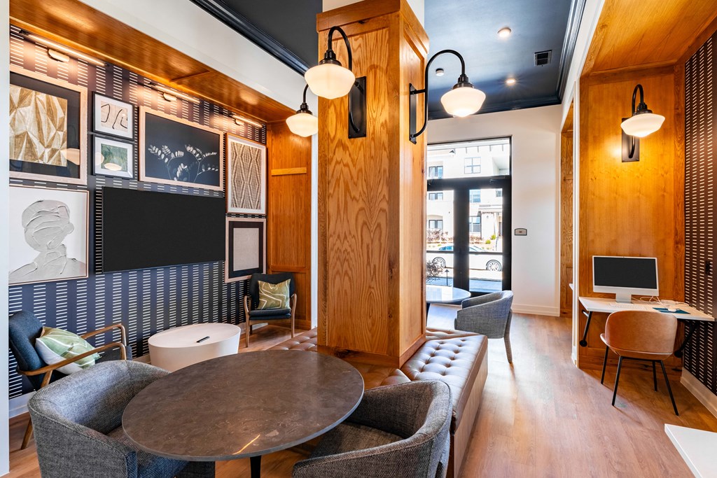 A modern living room with a wooden floor and furniture.