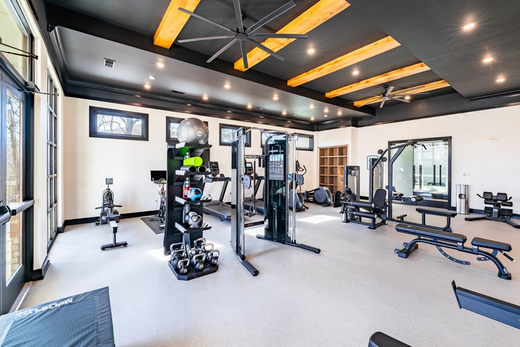 Amenities Highlight A spacious gym with a variety of equipment.