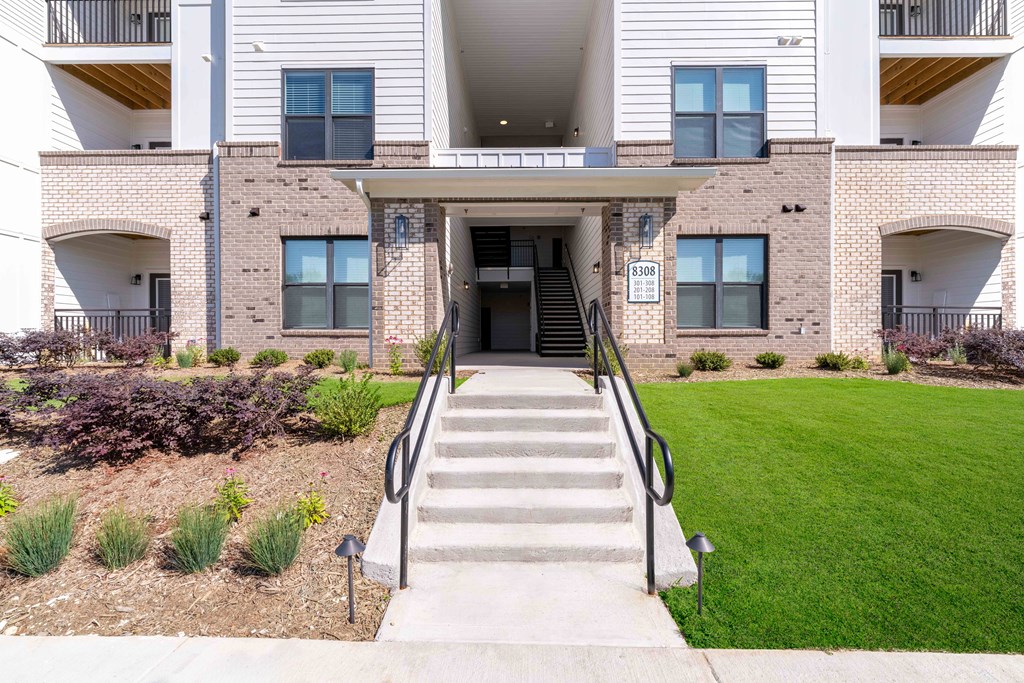 A building with a staircase leading to the entrance.