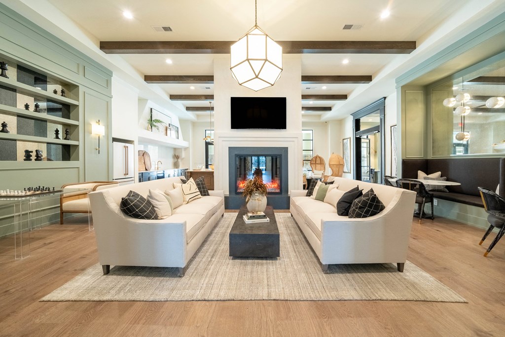a living room filled with furniture and a fireplace