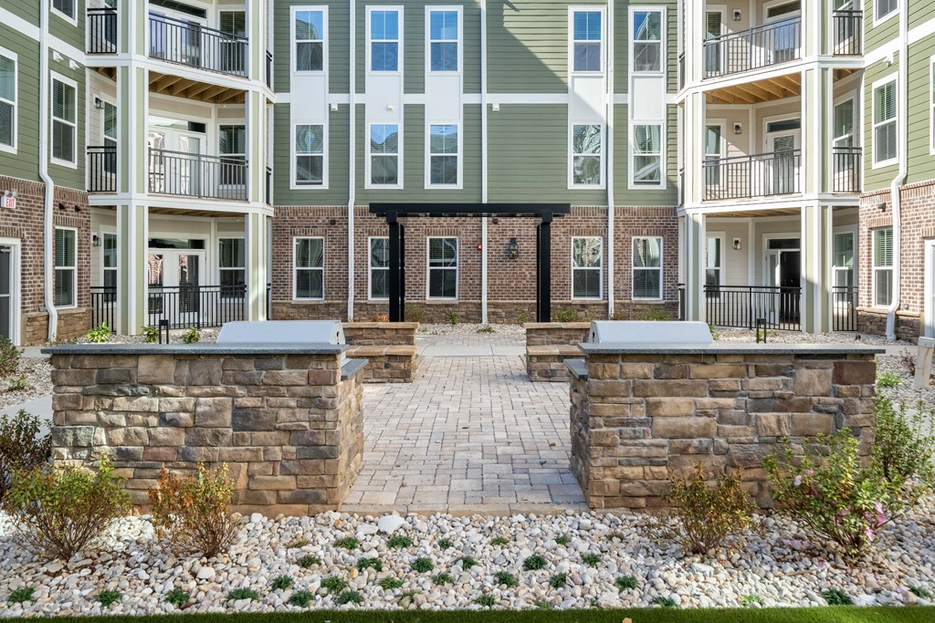 our apartments have a spacious courtyard with a stone wall