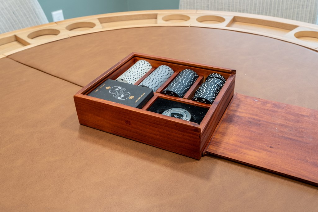 A wooden box with four compartments is open on a table.