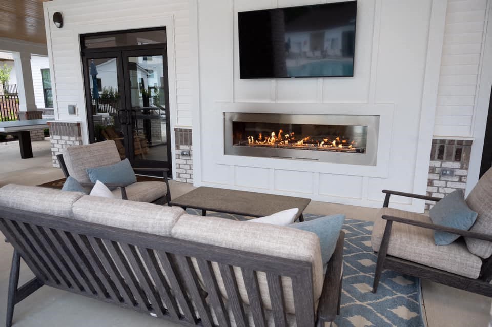 a living room with a couch and a fireplace