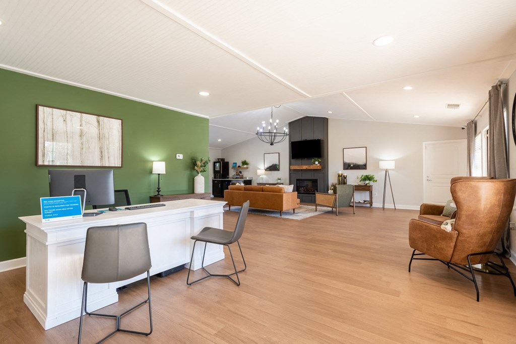 a living room and dining room with a white counter and chairs