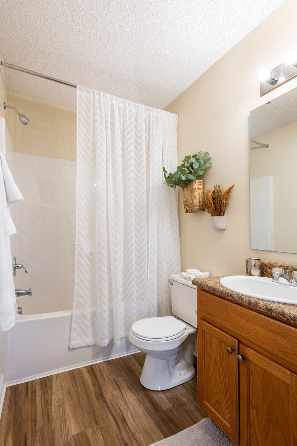 the preserve at ballantyne commons apartment bathroom with toilet sink and shower