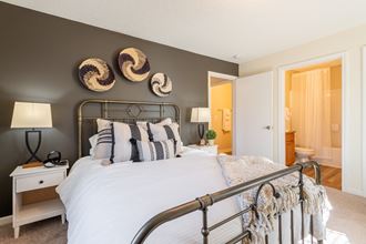 a bedroom with a bed and a nightstand